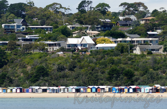 Mornington homes overlook the Bay and the colourful bathing boxes on the beach