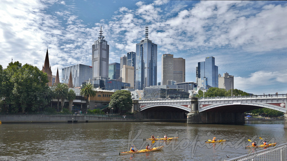 Melbourne cityscape from Southbank across the Yarra River with kayaks