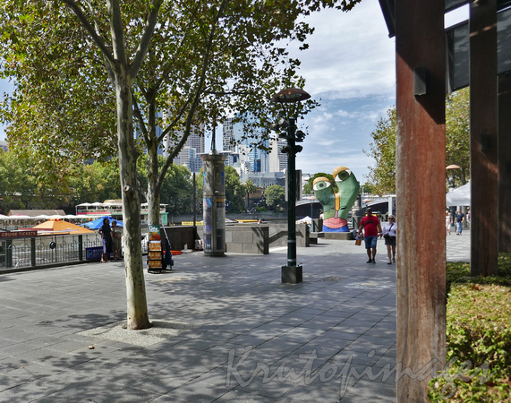 Melbourne Southbank Boulevard street scenne with art and the Yarra River