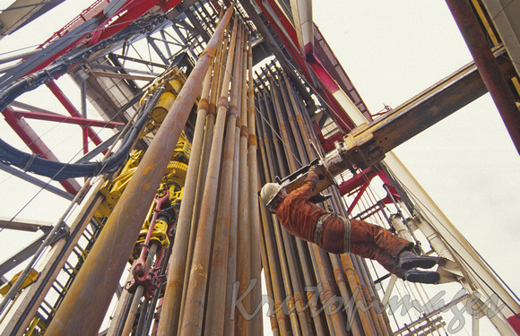 Roustabout worker checks overhang on Ocean Bounty drilling rig