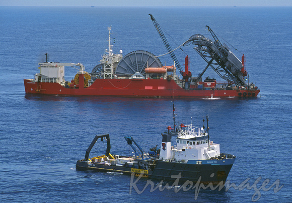 Apache laying pipe in Bass Strait-with Canning Tide work boat