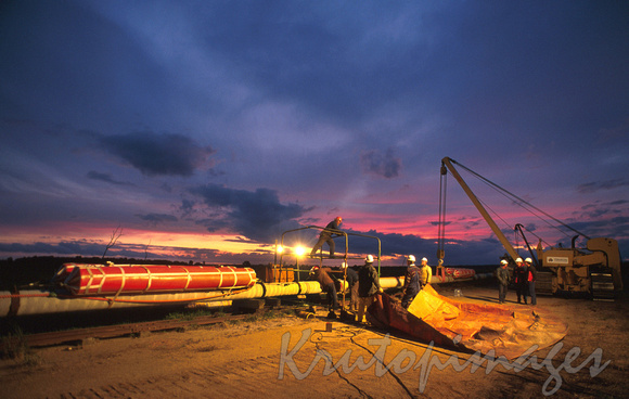 submersible Pipeline work at sunset