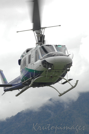 Helicopter over threatening misy skies PNG