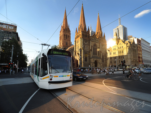 Melbourne Swanston Street  with tram and St Pauls Cathedral.