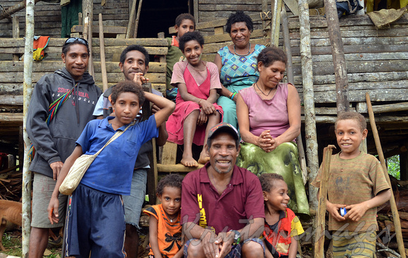 Family photo at Tugiri Village home PNG