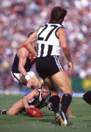 Gavin Brown with the ball on the ground 1990 AFL Grand Final