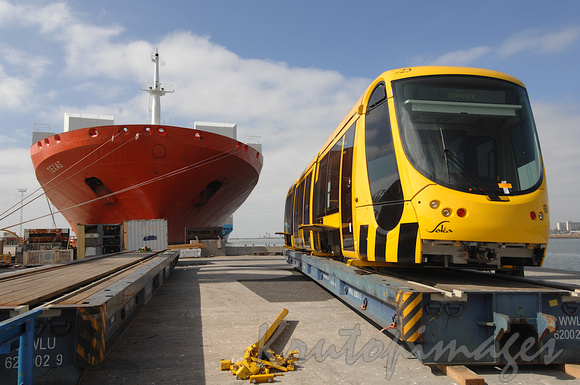 New articulated tram made in France arrives at Web Dock on huge carrier vessel called Texas-4