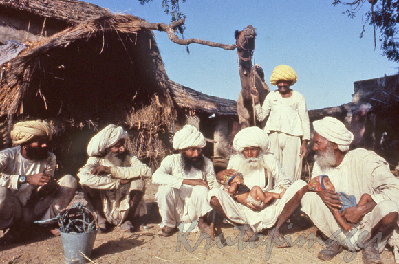 The elders of a remote Rajistani village- content with their grandchildren and old friends 1985