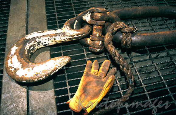 workgloves and hook resting on the main deck of an offshore platform