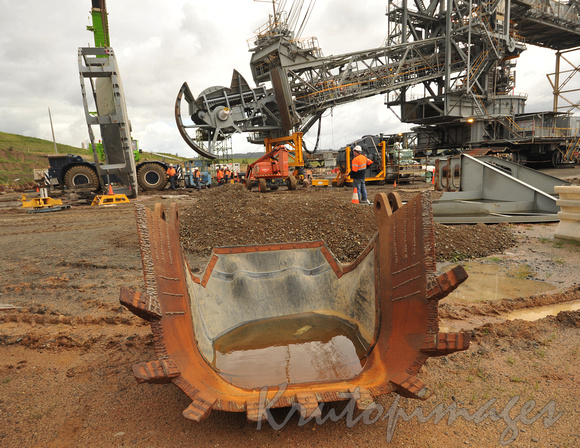 Dredge maintenance-replacing bucket wheel on site Yallourn opencut coal mine copy