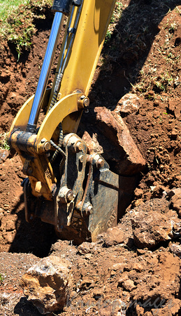 Digger removing soil during construction