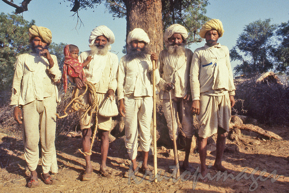 India-The elders of a remote Rajistani village- content with their grandchildren and old friends 1985