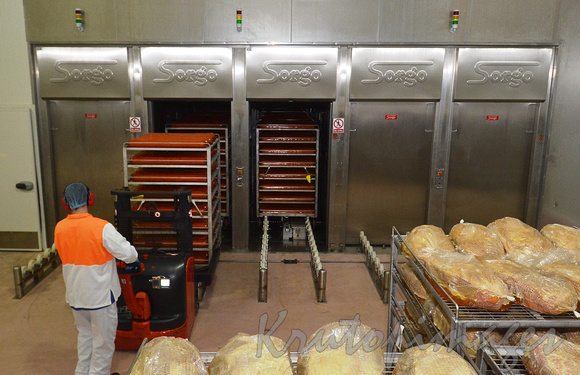 hams being loaded into ovens