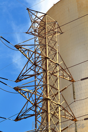 Transmission tower next to a cooling tower on location at Yallourn Power Station