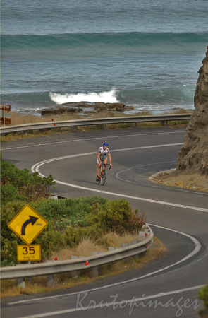 A lone cyclist travels the very scenic Great Ocean Road in South Western Victoriat