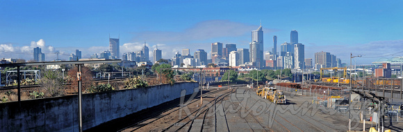 Jolimont sidings Melbourne with track grinder sitting idle and city backdrop