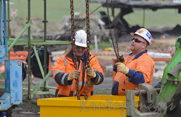 workers secure a lift onsite