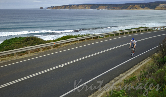 Cyclist  tavels the scenic Great Ocean Road in south Weatern Victoria