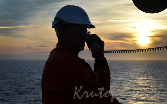 Offshore worker at sunset